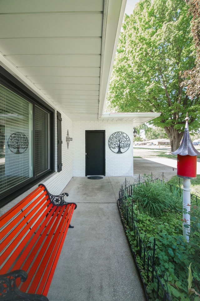 4143 Browning Dr, Saint Joseph, MI 49085 - property entrance featuring brick siding and covered porch