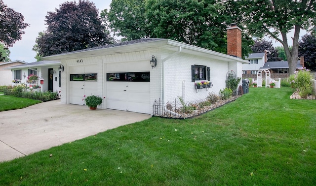 4143 Browning Dr, Saint Joseph, MI 49085 - view of front of home featuring a chimney, brick siding, a front lawn, driveway, and an attached garage