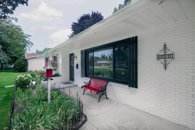 4143 Browning Dr, Saint Joseph, MI 49085 - property entrance featuring brick siding and covered porch