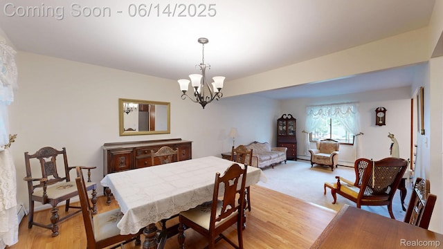 6624 Wellesley Ter, Clarkston, MI 48346 - dining space featuring a chandelier, light wood-style floors, and a baseboard heating unit