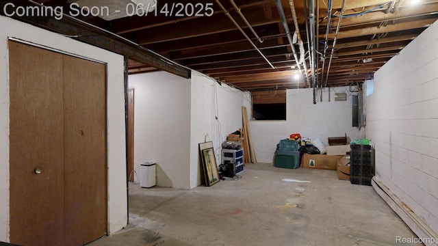 6624 Wellesley Ter, Clarkston, MI 48346 - unfinished below grade area with a baseboard radiator, concrete block wall, and electric panel