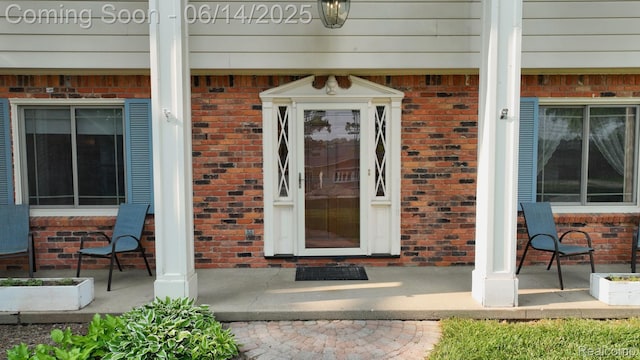 6624 Wellesley Ter, Clarkston, MI 48346 - property entrance featuring brick siding and covered porch