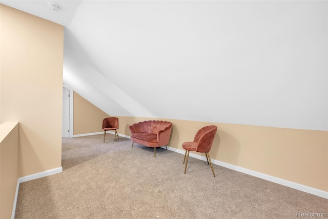 8857 Charlevoix St, Detroit, MI 48214 - living area with lofted ceiling, carpet, and baseboards