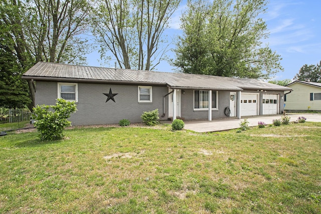 15765 Mason St, Union, MI 49130 - ranch-style house featuring an attached garage, metal roof, driveway, and brick siding