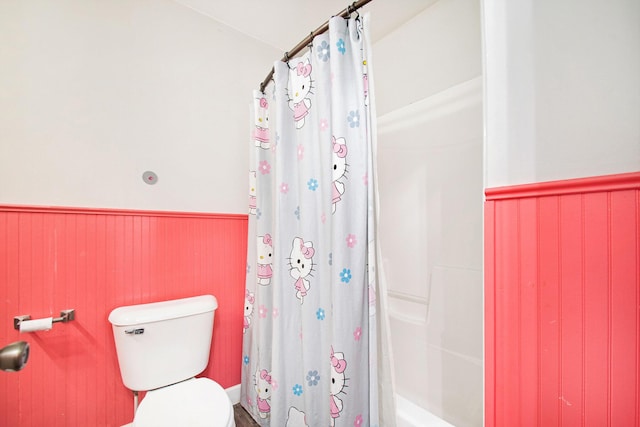 15765 Mason St, Union, MI 49130 - full bathroom featuring wainscoting, shower / bathtub combination with curtain, and toilet