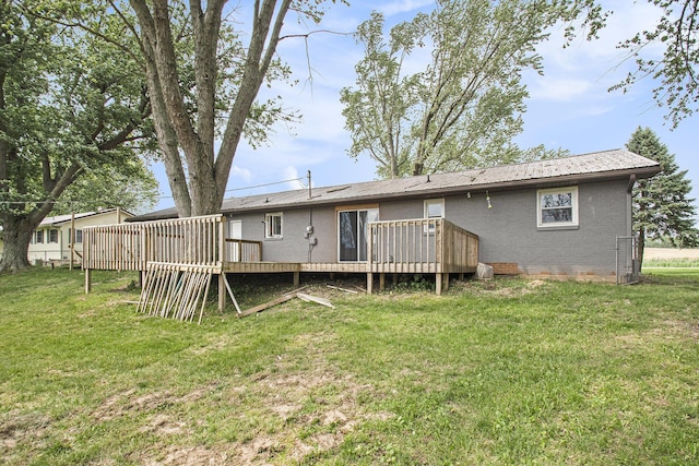 15765 Mason St, Union, MI 49130 - rear view of house featuring a deck, brick siding, and a lawn