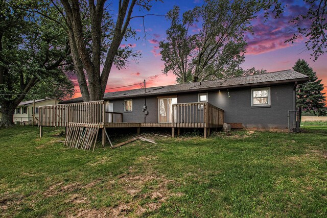 15765 Mason St, Union, MI 49130 - rear view of property with a deck, brick siding, and a yard