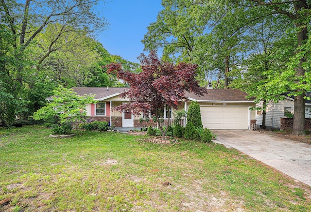 81 Dunton Ave, Holland, MI 49424 - view of property hidden behind natural elements featuring an attached garage, driveway, and a front lawn