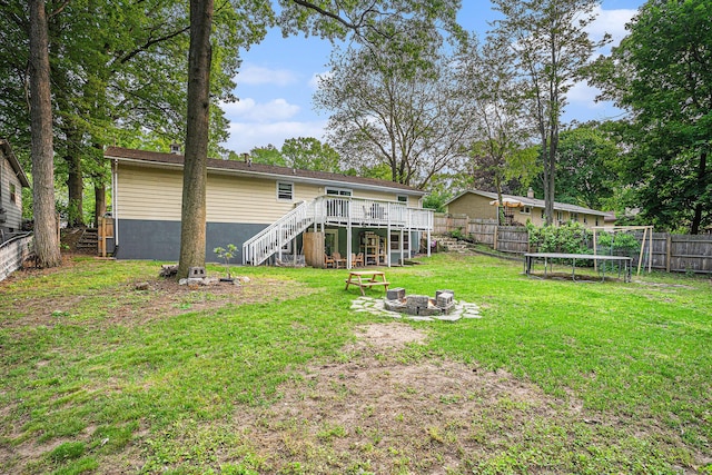 81 Dunton Ave, Holland, MI 49424 - rear view of house with stairs, a deck, and an outdoor fire pit