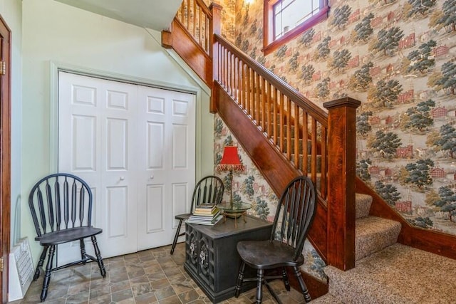 927 Harrison Ave, Saint Joseph, MI 49085 - staircase with wallpapered walls and stone finish flooring