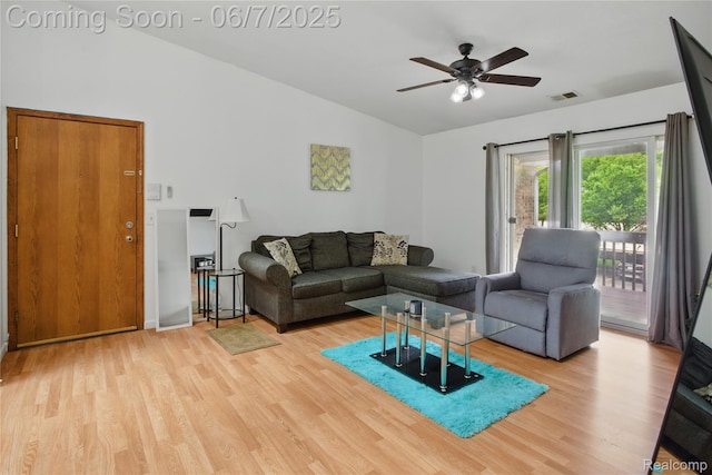 1332 Shoemaker Dr Unit 1332, Belleville, MI 48185 - living room with vaulted ceiling, light wood-style floors, and a ceiling fan