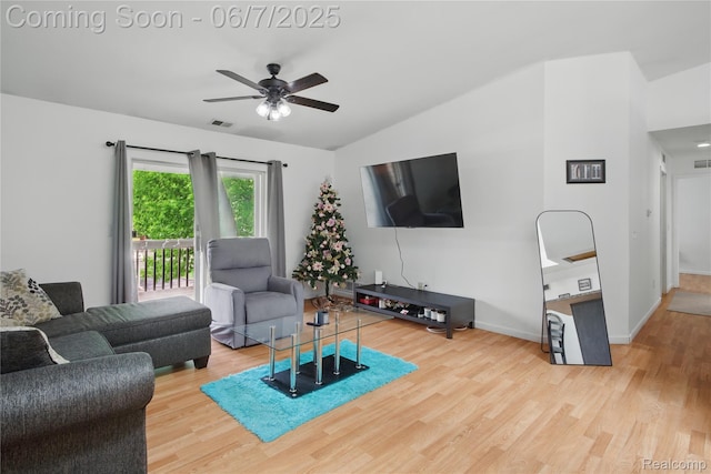 1332 Shoemaker Dr Unit 1332, Belleville, MI 48185 - living area with wood finished floors, ceiling fan, vaulted ceiling, and baseboards