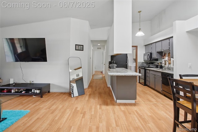 1332 Shoemaker Dr Unit 1332, Belleville, MI 48185 - kitchen with stainless steel range with electric stovetop, dishwasher, a towering ceiling, light wood-style flooring, and gray cabinetry