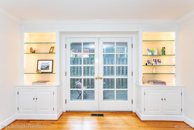 8019 Concord Rd, Huntington Woods, MI 48070 - doorway featuring light wood-style flooring, french doors, and crown molding