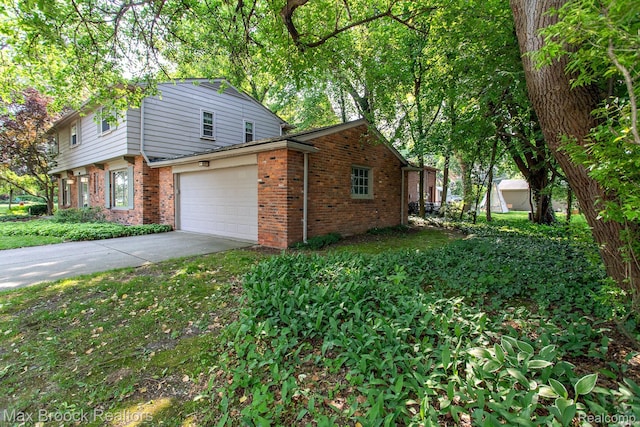 8019 Concord Rd, Huntington Woods, MI 48070 - view of property exterior featuring brick siding and driveway