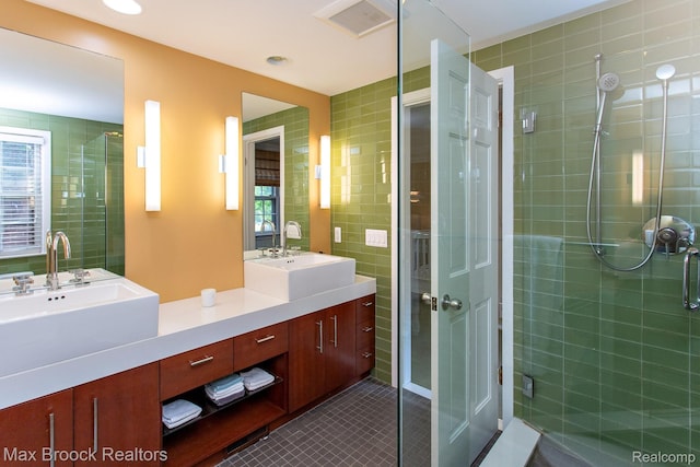 8019 Concord Rd, Huntington Woods, MI 48070 - full bathroom with double vanity, tile patterned floors, a stall shower, and tile walls