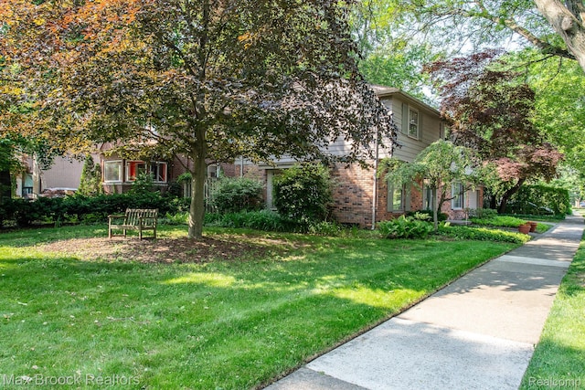 8019 Concord Rd, Huntington Woods, MI 48070 - view of front facade featuring brick siding and a front lawn