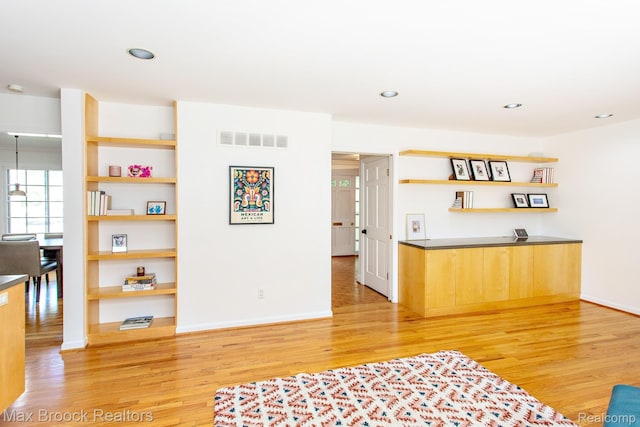 8019 Concord Rd, Huntington Woods, MI 48070 - living area with light wood finished floors and recessed lighting