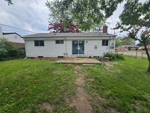 315 S Hanlon St, Westland, MI 48186 - rear view of house featuring a patio and a chimney
