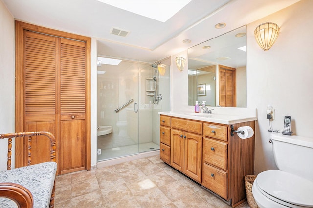 5700 Dexter Townhall Rd, Dexter, MI 48130 - full bath with vanity, a stall shower, a closet, and toilet