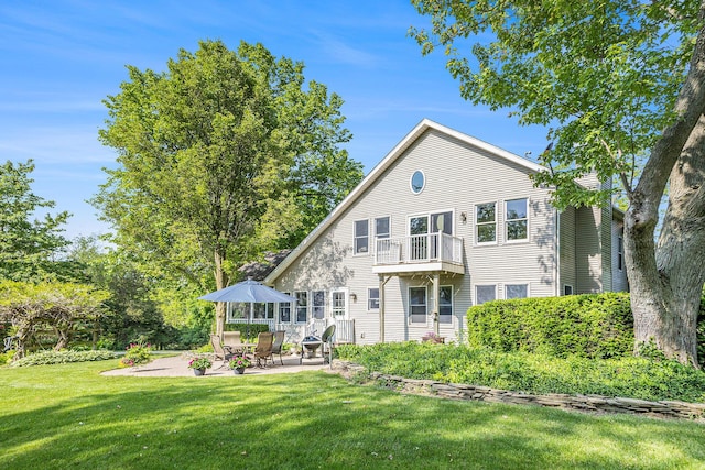 5700 Dexter Townhall Rd, Dexter, MI 48130 - rear view of property with a balcony, a yard, and a patio