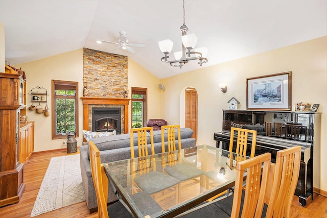 5700 Dexter Townhall Rd, Dexter, MI 48130 - dining room with arched walkways, light wood finished floors, a chandelier, lofted ceiling, and ceiling fan