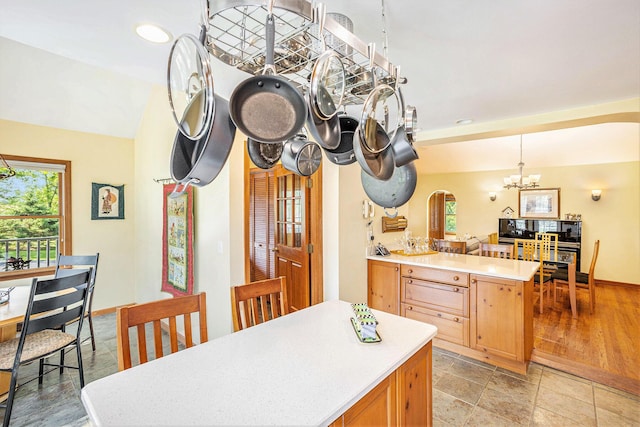 5700 Dexter Townhall Rd, Dexter, MI 48130 - kitchen with a chandelier, plenty of natural light, light countertops, a peninsula, and recessed lighting