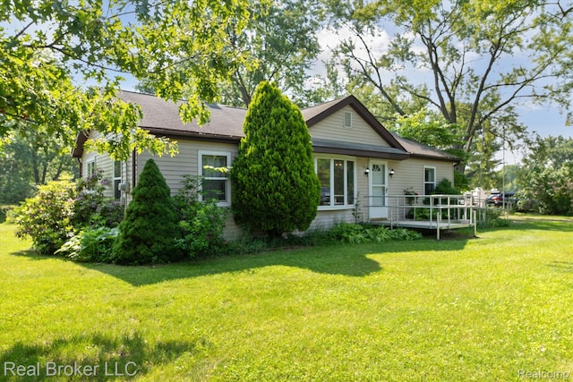 5740 M 66, East Leroy, MI 49051 - back of house with a lawn
