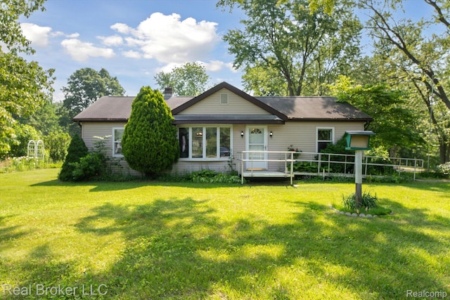 5740 M 66, East Leroy, MI 49051 - rear view of property featuring a lawn and a chimney