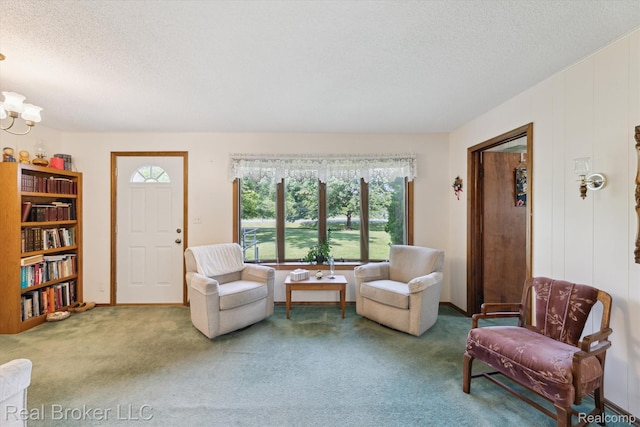 5740 M 66, East Leroy, MI 49051 - living room with a textured ceiling, carpet floors, and a chandelier