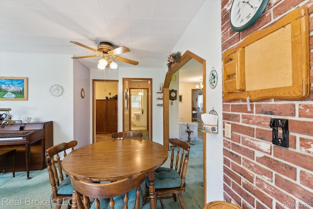 5740 M 66, East Leroy, MI 49051 - dining space featuring carpet flooring, ceiling fan, and arched walkways