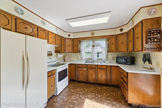 5740 M 66, East Leroy, MI 49051 - kitchen with white appliances, brown cabinets, and light countertops