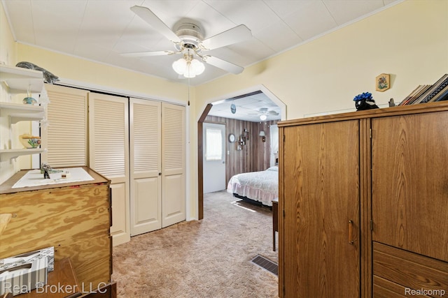 5740 M 66, East Leroy, MI 49051 - bedroom featuring light colored carpet, a closet, crown molding, arched walkways, and a ceiling fan