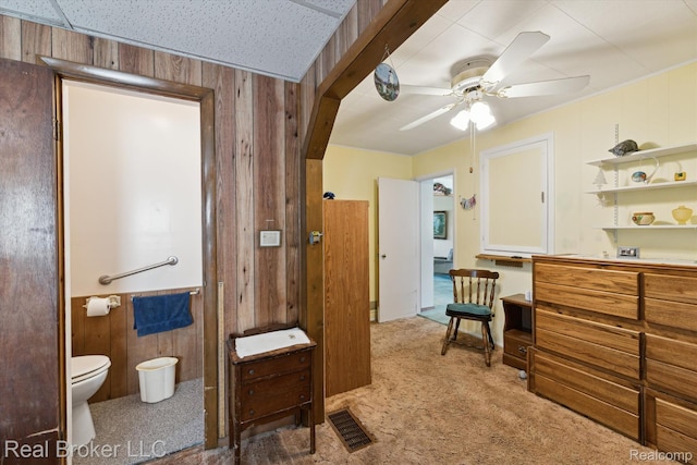 5740 M 66, East Leroy, MI 49051 - carpeted bedroom featuring wood walls and ensuite bathroom