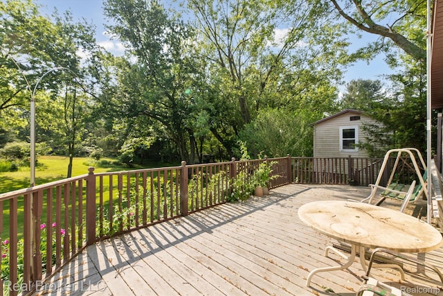 5740 M 66, East Leroy, MI 49051 - wooden terrace with view of scattered trees and an outdoor structure