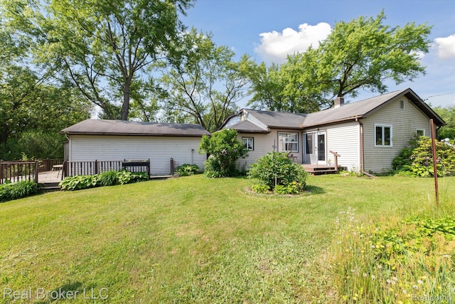 5740 M 66, East Leroy, MI 49051 - back of house featuring a lawn and a wooden deck
