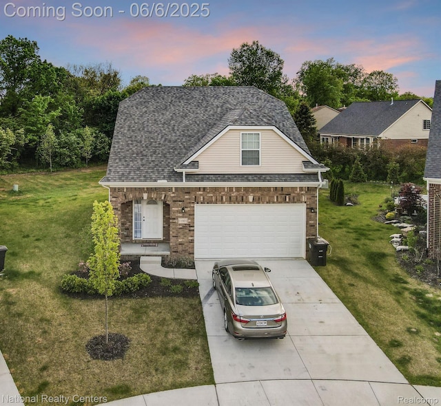 11801 Hines Place Dr, Livonia, MI 48150 - view of front of property featuring driveway, a front lawn, and brick siding