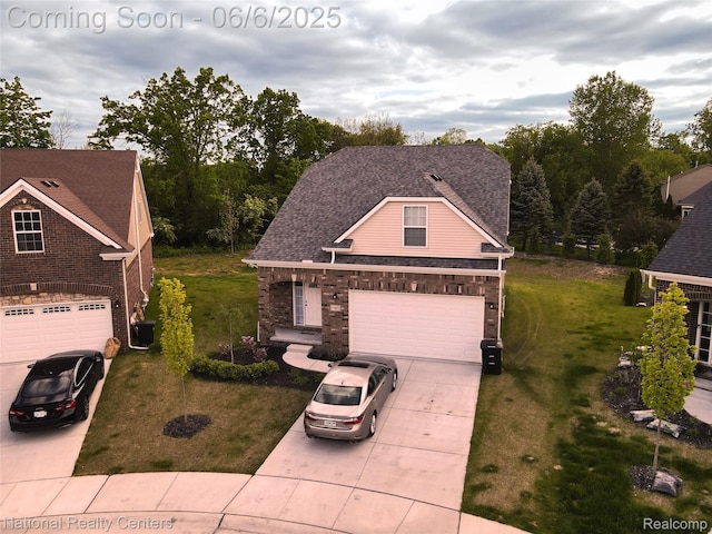 11801 Hines Place Dr, Livonia, MI 48150 - view of front of home with concrete driveway, a front yard, central AC unit, and roof with shingles