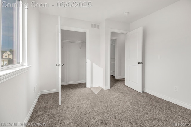 11801 Hines Place Dr, Livonia, MI 48150 - unfurnished bedroom with carpet floors, baseboards, and a closet