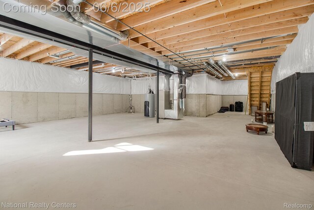 11801 Hines Place Dr, Livonia, MI 48150 - unfinished below grade area featuring heating unit and gas water heater