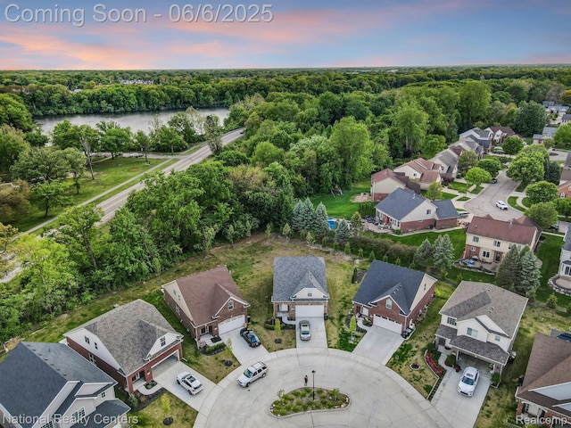 11801 Hines Place Dr, Livonia, MI 48150 - aerial perspective of suburban area with a nearby body of water and a forest