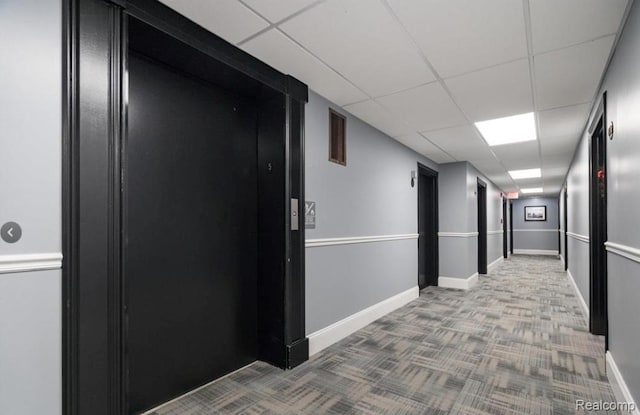 35300 Woodward Ave Unit 408, Birmingham, MI 48009 - corridor with carpet flooring, a paneled ceiling, and baseboards