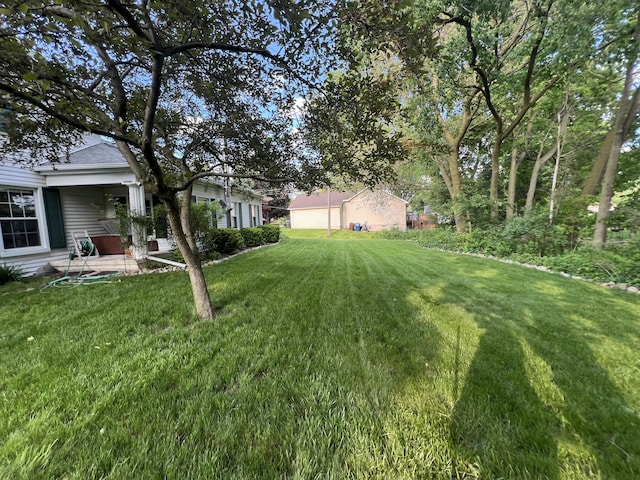 46860 Shelby Rd, Michigan, MI 48317 - view of grassy yard with a patio