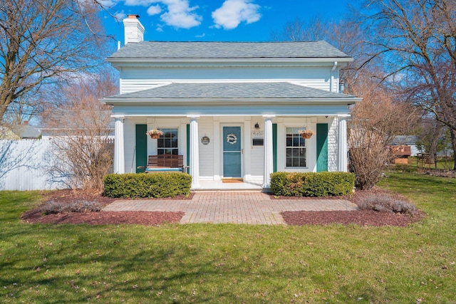 46860 Shelby Rd, Michigan, MI 48317 - greek revival inspired property with a chimney, a front yard, covered porch, and a shingled roof