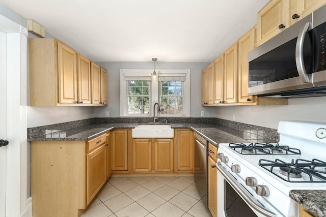 46860 Shelby Rd, Michigan, MI 48317 - kitchen featuring stainless steel appliances, a sink, light tile patterned floors, and light brown cabinets