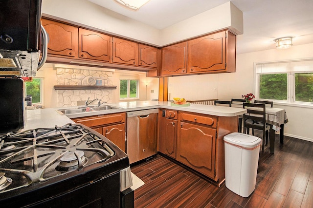 4014 Orchard Crest Dr, West Bloomfield, MI 48322 - kitchen featuring dishwasher, a sink, dark wood-style flooring, and light countertops