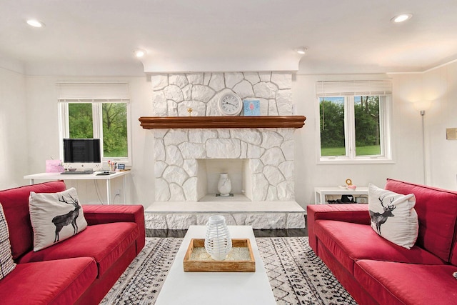 4014 Orchard Crest Dr, West Bloomfield, MI 48322 - living area with healthy amount of natural light, wood finished floors, a stone fireplace, and recessed lighting