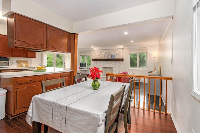4014 Orchard Crest Dr, West Bloomfield, MI 48322 - dining area featuring dark wood-type flooring, healthy amount of natural light, a stone fireplace, and recessed lighting