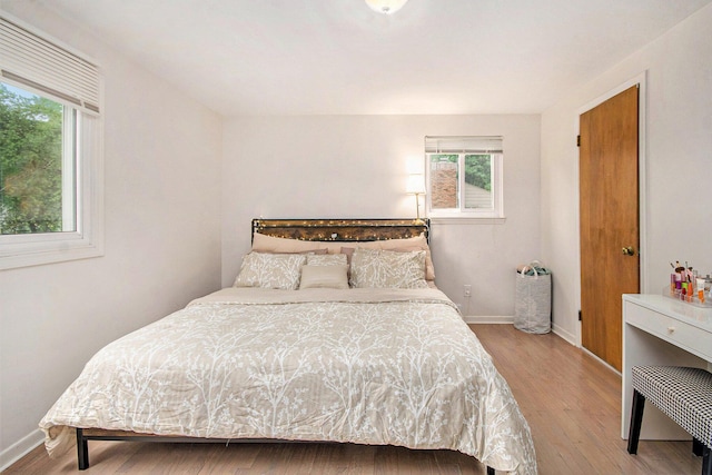 4014 Orchard Crest Dr, West Bloomfield, MI 48322 - bedroom featuring multiple windows, wood finished floors, and baseboards