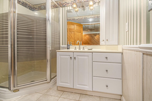 130 Woodway Ave, Battle Creek, MI 49014 - bathroom featuring tile patterned flooring, a shower stall, and vanity